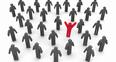 Red man standing out in a sea of grey men