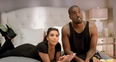 Kanye West and Kim Kardashian on bed