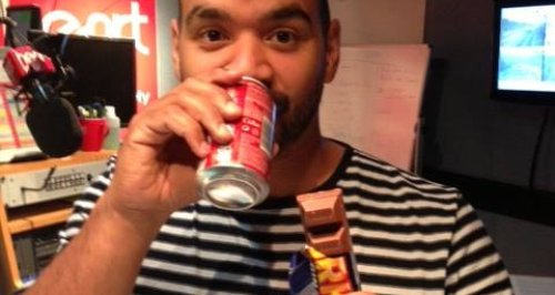 Michael drinking coke and eating Yorkie