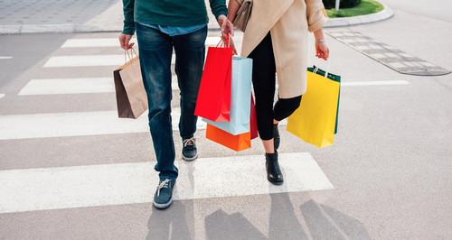 Couple Shopping Together With Shopping Bags